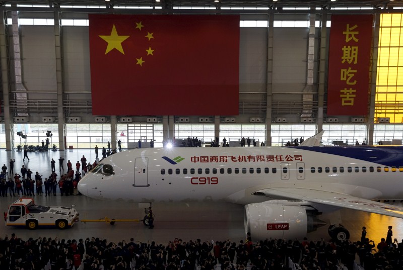 The Commercial Aircraft Corp of China rolled out its C919 narrow body jet, which is meant to rival similar models from Airbus Group and Boeing Co. China unveils passenger jet,passenger jet,C919,C919 passenger jet,Commercial Aircraft Corp of China,Airbus Group and Boeing Co,first passenger jet