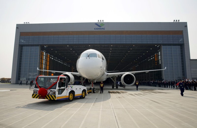 The Commercial Aircraft Corp of China rolled out its C919 narrow body jet, which is meant to rival similar models from Airbus Group and Boeing Co. China unveils passenger jet,passenger jet,C919,C919 passenger jet,Commercial Aircraft Corp of China,Airbus Group and Boeing Co,first passenger jet