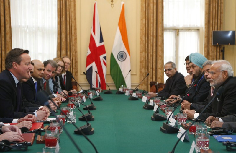 Prime Minister Narendra Modi arrived in London on Thursday (12 November) for his first visit to the United Kingdom since he assumed office. Narendra Modi,Narendra Modi UK Visit,Narendra Modi UK Visit Day 1,Narendra Modi in UK,Narendra Modi addesses,David Cameron,modi and David Cameron,Narendra Modi and David Cameron