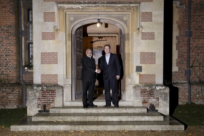 Prime Minister Narendra Modi arrived in London on Thursday (12 November) for his first visit to the United Kingdom since he assumed office. Narendra Modi,Narendra Modi UK Visit,Narendra Modi UK Visit Day 1,Narendra Modi in UK,Narendra Modi addesses,David Cameron,modi and David Cameron,Narendra Modi and David Cameron