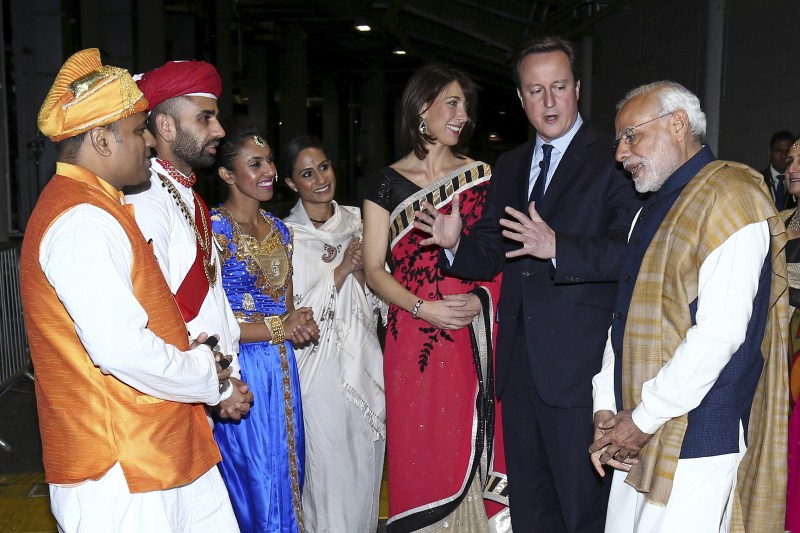 PM Modi accompanied by his British counterpart David Cameron walks towards the stage for his address at Wembley. Narendra modi,Narendra modi address at Wembley Stadium,Narendra modi address,modi,Narendra modi at Wembley Stadium,Wembley Stadium,Modi speech,Narendra modi speech