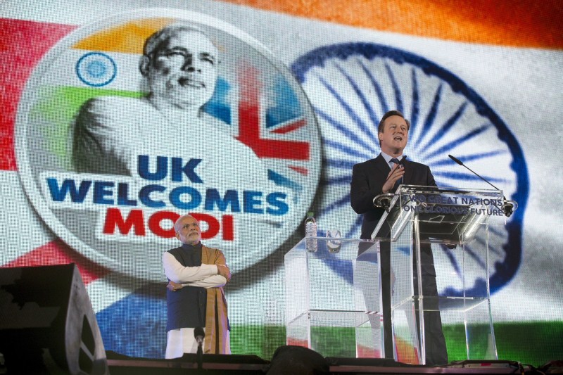 PM Modi accompanied by his British counterpart David Cameron walks towards the stage for his address at Wembley. Narendra modi,Narendra modi address at Wembley Stadium,Narendra modi address,modi,Narendra modi at Wembley Stadium,Wembley Stadium,Modi speech,Narendra modi speech