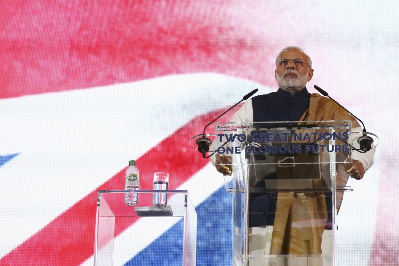 PM Modi accompanied by his British counterpart David Cameron walks towards the stage for his address at Wembley. Narendra modi,Narendra modi address at Wembley Stadium,Narendra modi address,modi,Narendra modi at Wembley Stadium,Wembley Stadium,Modi speech,Narendra modi speech
