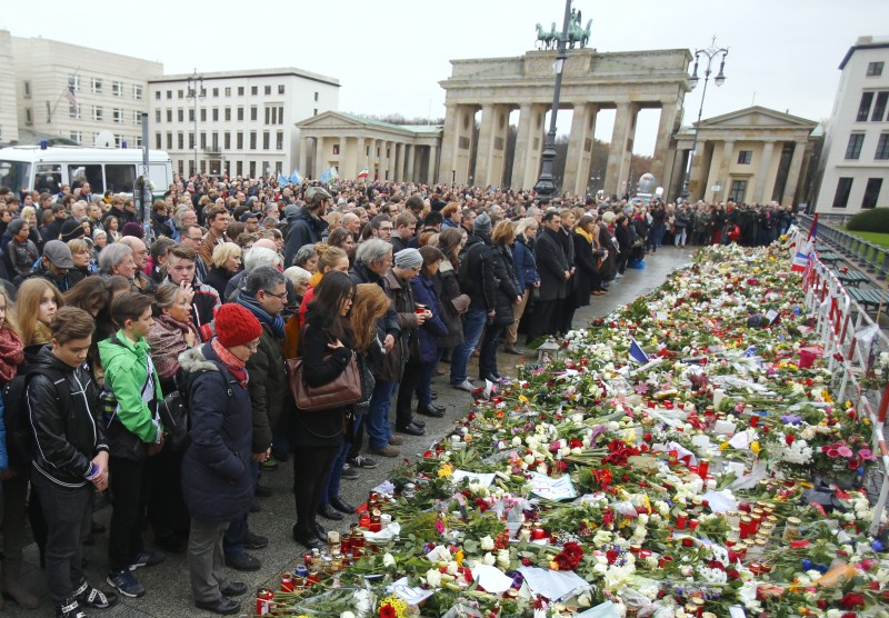 Photos of People observe a minute of silence in tribute to victims of Friday's attacks. Paris attacks,Paris attack,ISIS Paris Attacks,France observes a Minute's Silence for Victims,one Minute Silence for Victims,France observes one Minute Silence for Victims,one Minute Silence,Brandenburg Gate