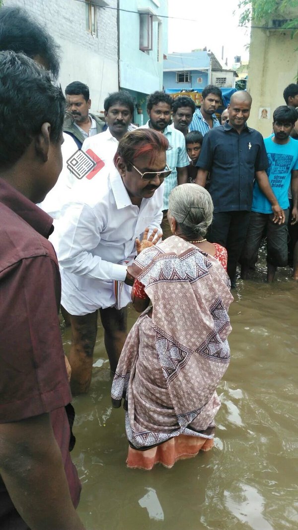 DMDK leader Vijayakanth meets rain affected victims in Chennai. Vijayakanth,Vijayakanth meets rain affected victims in Chennai,DMDK leader Vijayakanth,heavyrain in chennai,Chennai affected victims,Chennai rain