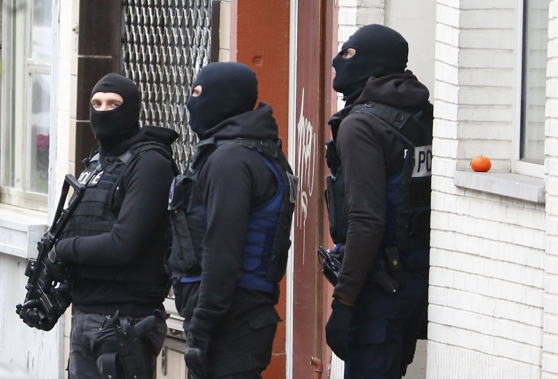 Belgian police surround houses as they search for suspects in connection with the attacks on Paris. Paris attack,Paris attack 2015,Police search for suspects,Police search for suspects in France,Police search for suspects in Belgium,Paris police,Terrorism,Terrorists