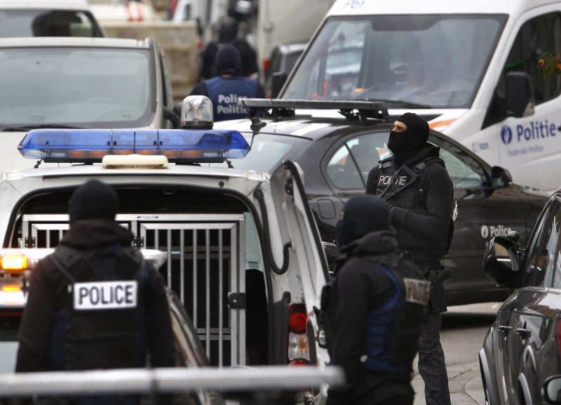 Belgian police surround houses as they search for suspects in connection with the attacks on Paris. Paris attack,Paris attack 2015,Police search for suspects,Police search for suspects in France,Police search for suspects in Belgium,Paris police,Terrorism,Terrorists