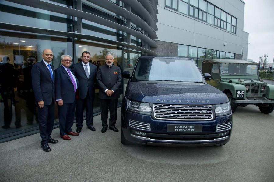 The PM was shown around the facility at Solihull in England by Tata Group chairman Cyrus Mistry, Jaguar Land Rover (JLR) CEO Ralf Speth Narendra modi,narendra modi visits JLR plant,JLR plant,Jaguar land rover plant,modi at Jaguar Land Rover plant,modi UK visit,Modi trips
