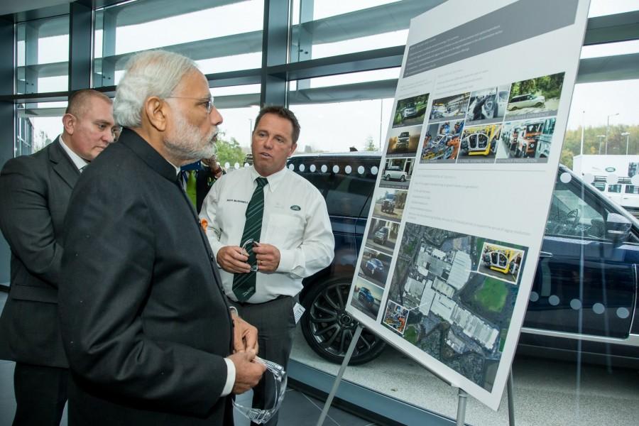 The PM was shown around the facility at Solihull in England by Tata Group chairman Cyrus Mistry, Jaguar Land Rover (JLR) CEO Ralf Speth Narendra modi,narendra modi visits JLR plant,JLR plant,Jaguar land rover plant,modi at Jaguar Land Rover plant,modi UK visit,Modi trips