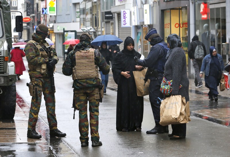 Soldiers patrolled the streets of Brussels on the third day of a security lockdown on Monday and the tenth day of a manhunt for the suspected mastermind of the 13 November attacks in Paris. Brussels Terror Alert,Terror Alert,Paris attacks,Paris terror attack,Soldiers patrolled,Brussels security