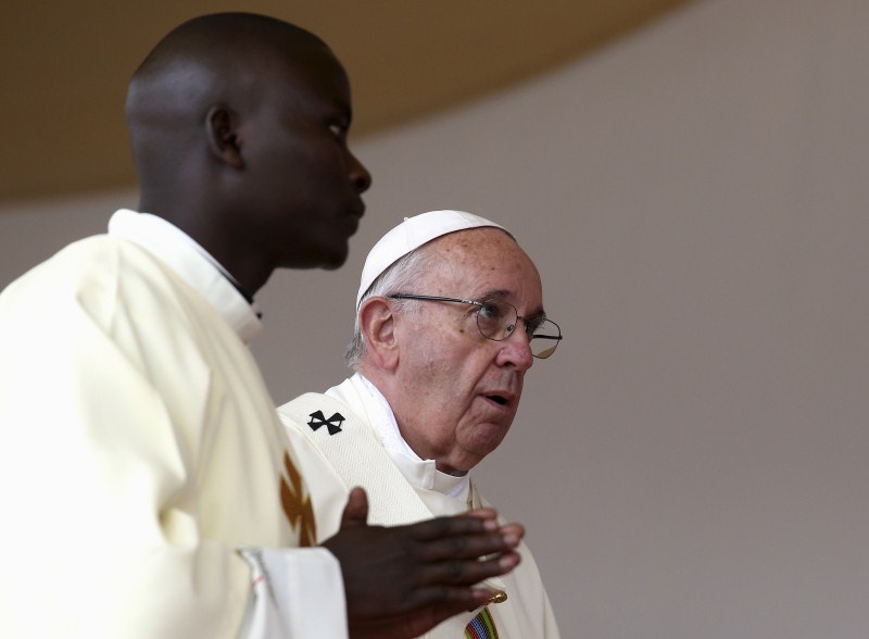 Pope Francis waves to faithful as he arrives for a Papal mass in Kenya's capital Nairobi. Pope Francis,Pope Francis Lands in Africa,Pope Francis in Africa,Pope Francis in Kenya