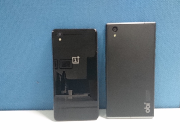 Take a look at the photos of OnePlus X and Obi Worldphone SF1 side-by-side. OnePlus X vs Obi Worldphone SF1,OnePlus X comparison,OnePlus X review,OnePlus X design,OnePlus X photos,Obi Worldphone SF1,Obi Worldphone SF1 comparison,Obi Worldphone SF1 vs oneplus x,Obi Worldphone SF1 photos,Obi Worldphone SF1 photo comparison,Obi Worl