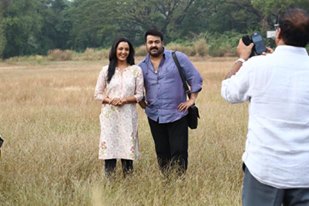 Mohanlal and Manju Warrier in 'Ennum Eppozhum' Mohanlal and Manju Warrier,Manju Warrier,Mohanlal,Ennum Eppozhum,Ennum Eppozhum stills,Ennum Eppozhum posters