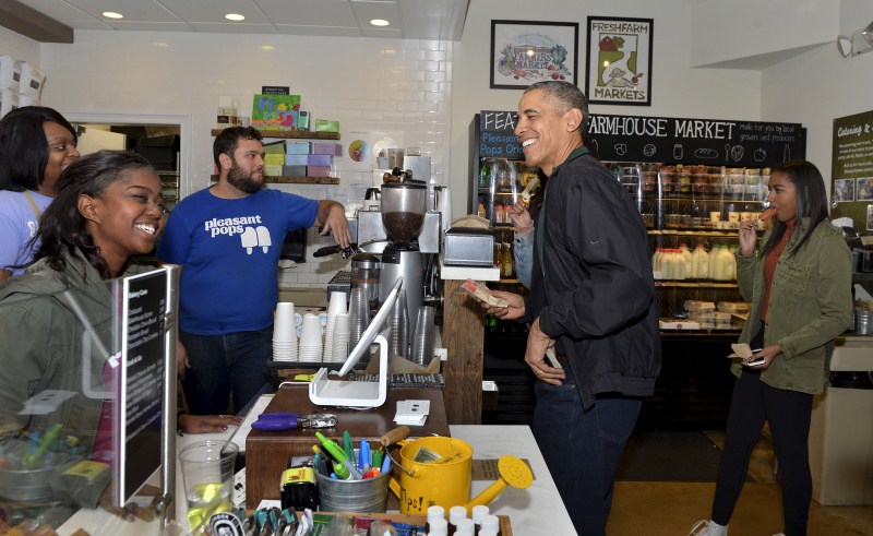 President Barack Obama took his teenage daughters Malia and Sasha shopping on Saturday for books and a sweet treat to promote Small Business Saturday, an annual event designed to boost holiday shopping at mom-and-pop shops. Barack Obama,Barack Obama shops at Washington bookstore,Barack Obama at Washington bookstore,Washington bookstore,Malia and Sasha,President Barack Obama