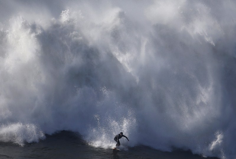 Portugal's Praia do Norte has become legendary for big wave surfing. Monster Waves at Nazare,Monster Waves at Nazare in Portugal,Monster Waves,wave surfing