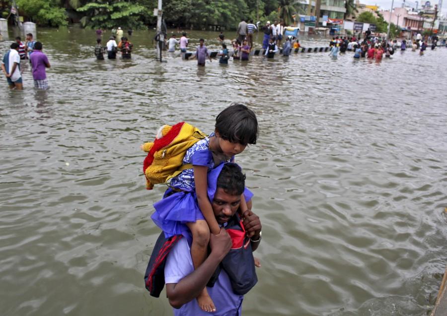 After some days of respite, fresh downpour on Tuesday crippled life here, flooding numerous roads and neighbourhoods and causing traffic jams and power cuts. Chennai Rainfall,Chennai battles Flooding after Heavy Rainfall,Chennai Flooding,Heavy Rainfall Chennai,ChennaiFloods,#ChennaiFloods,Chennai Floods