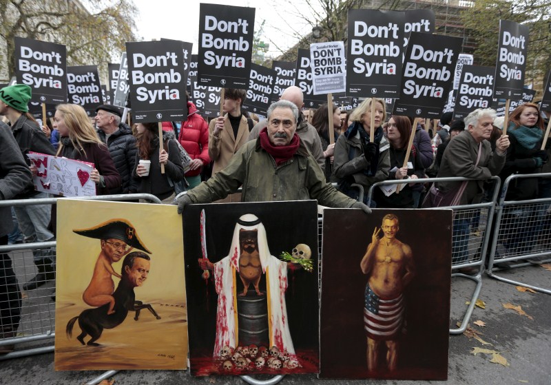 Britain's Parliament votes to launch bombing raids against Islamic State in Syria after more than 10 hours of tense debate. Anti-war protests in London,Anti-war protests,Islamic State,Syria