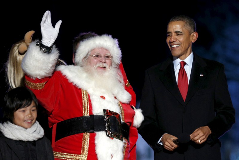 U.S. President Barack Obama and his family led the lighting of the National Christmas Tree, with charity, thanks, and a moment of reflection for the victims of Wednesday's shooting. Barack Obama,Barack Obama lights Christmas tree,Obama lights Christmas tree,Obama hugs Santa Claus,Christmas Tree Lighting,Obama