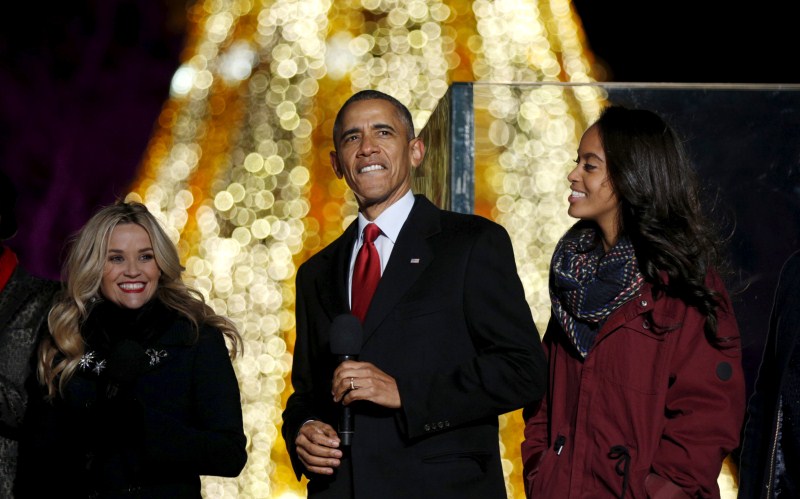 U.S. President Barack Obama and his family led the lighting of the National Christmas Tree, with charity, thanks, and a moment of reflection for the victims of Wednesday's shooting. Barack Obama,Barack Obama lights Christmas tree,Obama lights Christmas tree,Obama hugs Santa Claus,Christmas Tree Lighting,Obama