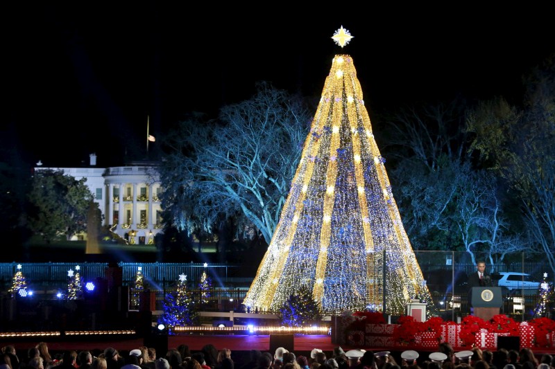 U.S. President Barack Obama and his family led the lighting of the National Christmas Tree, with charity, thanks, and a moment of reflection for the victims of Wednesday's shooting. Barack Obama,Barack Obama lights Christmas tree,Obama lights Christmas tree,Obama hugs Santa Claus,Christmas Tree Lighting,Obama