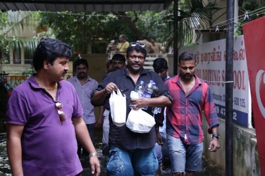 Tamil actor Parthiban helped many victims of the Chennai floods by providing relief supplies to them directly at Vembuli Amman Koil Street in Virugambakkam, Chennai.