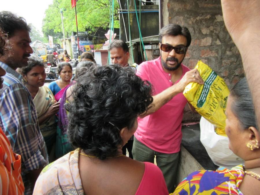 Tamil actor Mohan helped many villagers, who were affected by the flood in Mylapore area in Chennai. Tamil actor Mohan,Tamil actor Mohan helps chennai people,chennai floods,chennai rains,Celebs help chennaites