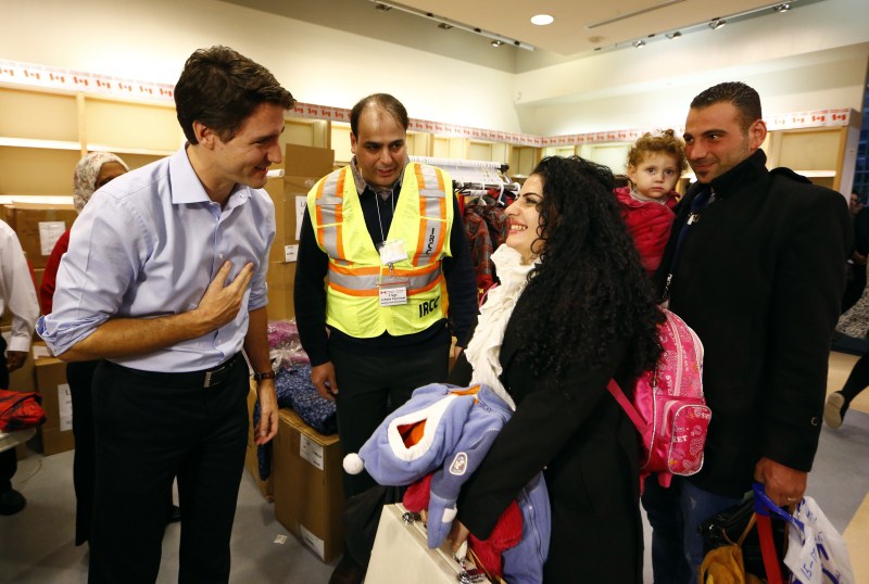The first plane load of Syrian refugees arrived in Toronto on a military aircraft. Canada Welcomes Syrian Refugees,Syrian Refugees,Canada prime minister,Canada prime minister welcomes wave of Syrian refugees,Justin Trudeau