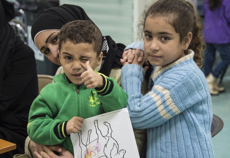 The first plane load of Syrian refugees arrived in Toronto on a military aircraft. Canada Welcomes Syrian Refugees,Syrian Refugees,Canada prime minister,Canada prime minister welcomes wave of Syrian refugees,Justin Trudeau