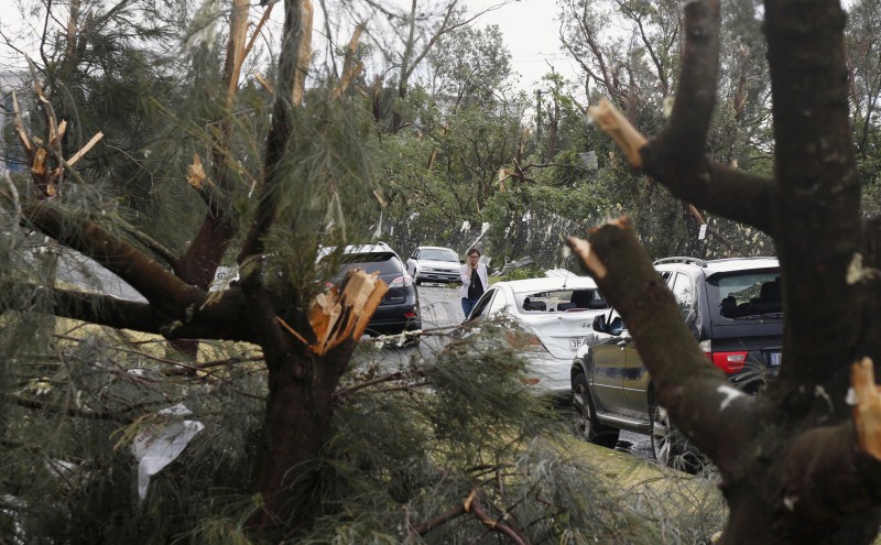 A rare tornado hits the suburbs of Sydney with destructive winds above 200km an hour (125 mph) and cricket ball-sized hail, bringing down trees and power lines, sheering off roofs and causing flash flooding in Australia’s largest city. Rare tornado,Tornado takes Sydney,Tornado hits Sydney,thunderstorms,thunderstorms hits Australia,thunderstorms hits Sydney