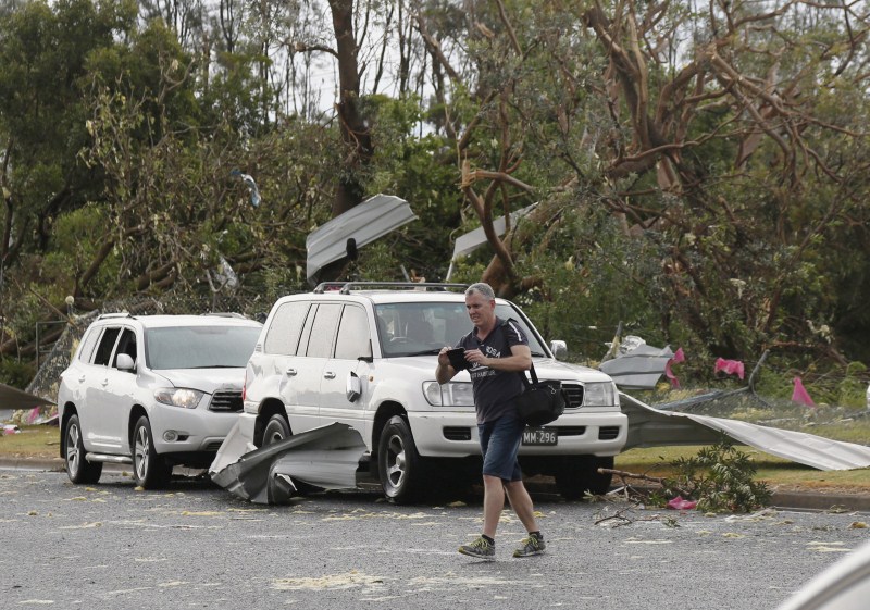 A rare tornado hits the suburbs of Sydney with destructive winds above 200km an hour (125 mph) and cricket ball-sized hail, bringing down trees and power lines, sheering off roofs and causing flash flooding in Australia’s largest city. Rare tornado,Tornado takes Sydney,Tornado hits Sydney,thunderstorms,thunderstorms hits Australia,thunderstorms hits Sydney