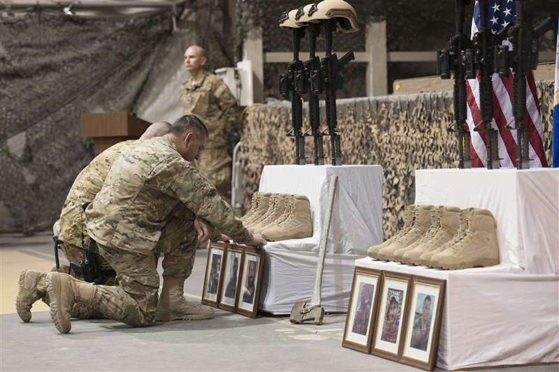 Fellow troops mourn for six U.S. service members killed by a suicide bomber near Bagram air base in Afghanistan. Mourning in Bagram,Bagram air base,Afghanistan,Bagram Air Field,Bagram ataack