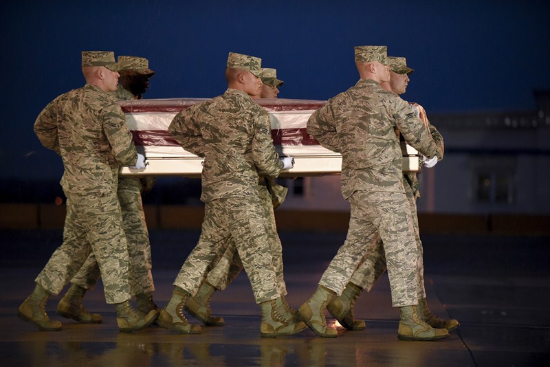 Fellow troops mourn for six U.S. service members killed by a suicide bomber near Bagram air base in Afghanistan. Mourning in Bagram,Bagram air base,Afghanistan,Bagram Air Field,Bagram ataack