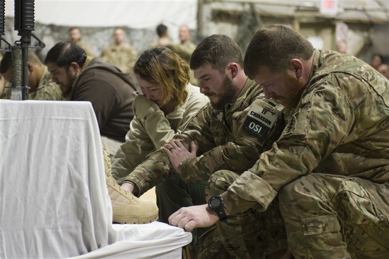 Fellow troops mourn for six U.S. service members killed by a suicide bomber near Bagram air base in Afghanistan. Mourning in Bagram,Bagram air base,Afghanistan,Bagram Air Field,Bagram ataack