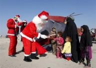 Santa Claus pays a visit to poor families and Christians fleeing Islamic State in the Baghdad area.