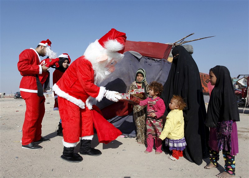 Santa Claus pays a visit to poor families and Christians fleeing Islamic State in the Baghdad area. Christmas celebration in Iraq,Christmas celebration,Christmas celebration in Islamic State,Santa Claus,Baghdad area,Islamic State
