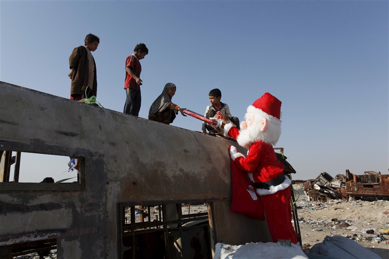 Santa Claus pays a visit to poor families and Christians fleeing Islamic State in the Baghdad area. Christmas celebration in Iraq,Christmas celebration,Christmas celebration in Islamic State,Santa Claus,Baghdad area,Islamic State
