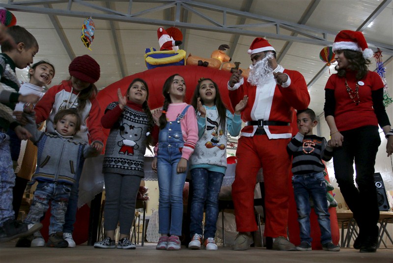 Santa Claus pays a visit to poor families and Christians fleeing Islamic State in the Baghdad area. Christmas celebration in Iraq,Christmas celebration,Christmas celebration in Islamic State,Santa Claus,Baghdad area,Islamic State