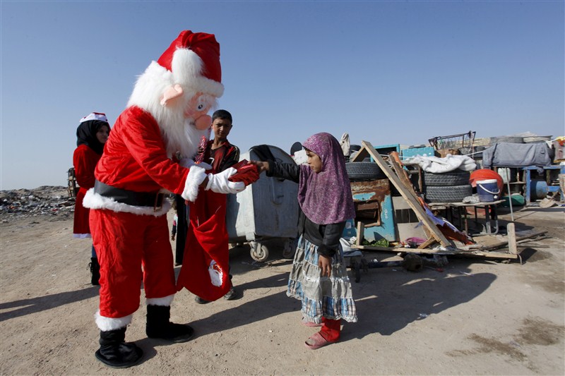 Santa Claus pays a visit to poor families and Christians fleeing Islamic State in the Baghdad area. Christmas celebration in Iraq,Christmas celebration,Christmas celebration in Islamic State,Santa Claus,Baghdad area,Islamic State