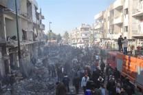 At least 32 people were killed and 90 others were injured as twin bombings rocked Syria's Al-Zahra' district of Homs city, said the Syrian Observatory for Human Rights, a UK-based watchdog.