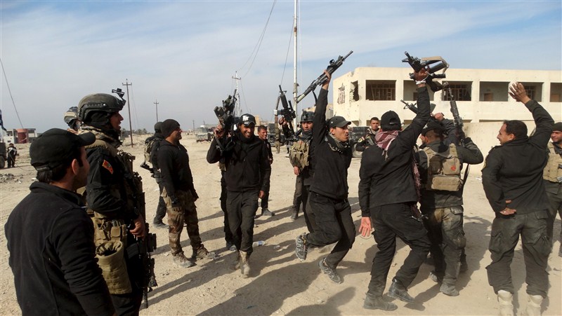 Iraq flies its flag above Ramadi's government complex, marking its military's first major victory since fleeing from Islamic State 18 months ago. Ramadi liberated from Islamic State,Ramadi,Islamic State,Iraq,Iraq flies flag,iraq victory,ISIS,ISIS loses