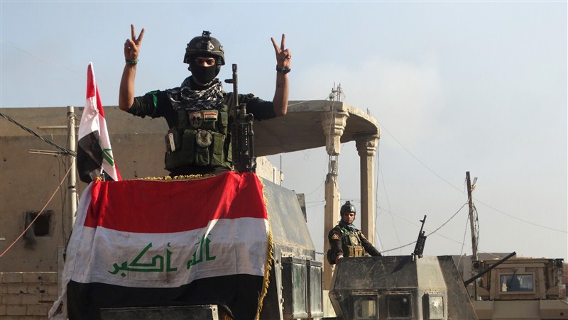 Iraq flies its flag above Ramadi's government complex, marking its military's first major victory since fleeing from Islamic State 18 months ago. Ramadi liberated from Islamic State,Ramadi,Islamic State,Iraq,Iraq flies flag,iraq victory,ISIS,ISIS loses