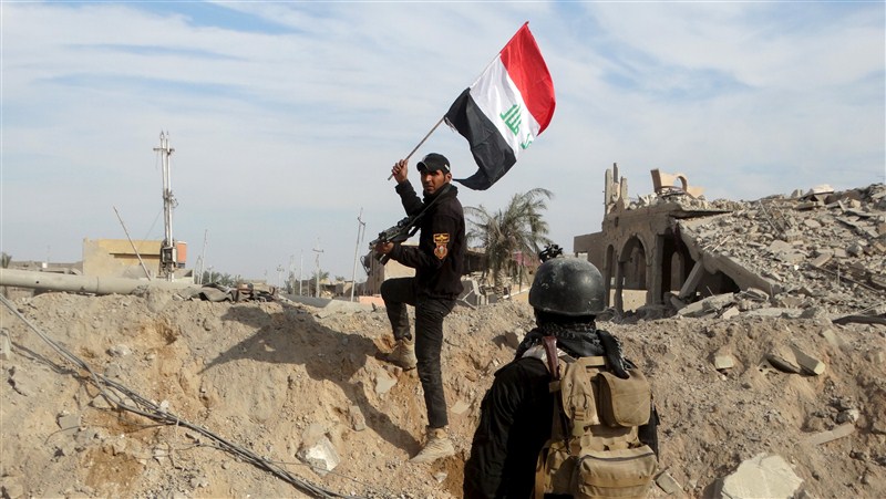 Iraq flies its flag above Ramadi's government complex, marking its military's first major victory since fleeing from Islamic State 18 months ago. Ramadi liberated from Islamic State,Ramadi,Islamic State,Iraq,Iraq flies flag,iraq victory,ISIS,ISIS loses