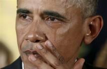 President Barack Obama wipes away tears as he lays out new steps to tighten gun rules.