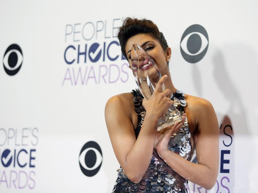 Bollywood actress and former Miss World Priyanka Chopra has won the Favourite Actress in a New TV series award at the People's Choice Awards (PCA) 2016 here for her lead role in American TV thriller series Priyanka Chopra,Priyanka Chopra wins People's Choice Awards,People's Choice Awards,People's Choice Awards 2016,PCA,PCA 2016,American TV thriller series,Quantico,actress Priyanka Chopra,Priyanka Chopra wins People's Choice Award for ?