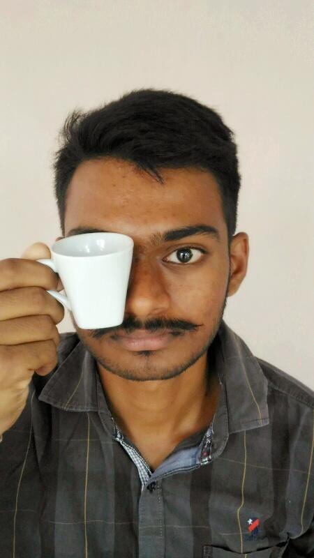 Sandalwood Actor Shivaraj Kumar's style on the poster of Shivaraj Kumar,Killing Veerappan,Coffee mug pose,Tea mug photo,Shivaraj kumar holding coffee mug,Ram Gopal Varma,funny selfies,funny Selfie