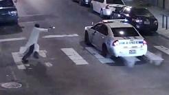 A gunman shoots a police officer by firing into his patrol car 11 times 