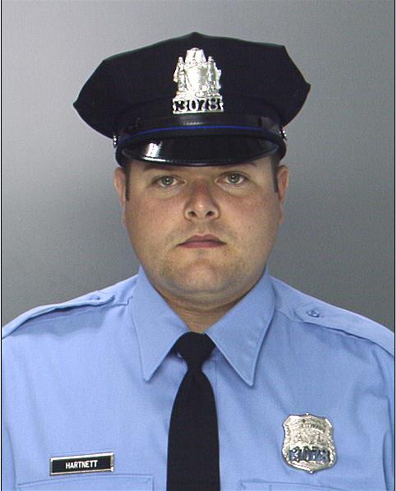 A gunman shoots a police officer by firing into his patrol car 11 times Philadelphia,Philadelphia police,West Philadelphia,Police shooting,Police officer shot,Philadelphia police officer shot,injured in car,in the name of Islam,Gunman ambushes Philadelphia cop,Gunman ambushes cop