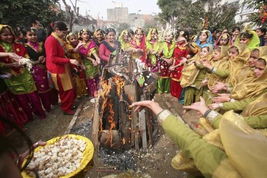 Lohri festival marks the culmination of winter in many parts of northern India. Here are some photos of Lohri festival celebration across India.