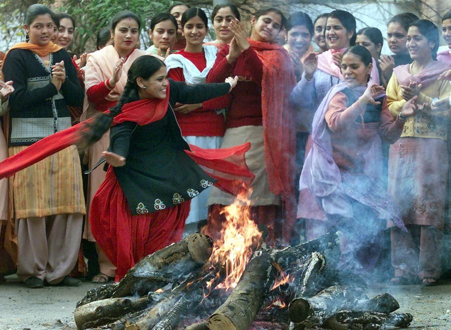 Lohri festival marks the culmination of winter in many parts of northern India. Here are some photos of Lohri festival celebration across India. Lohri,Lohri festival celebration,Lohri festival celebration in India,Lohri celebration in India,Lohri celebration,Lohri 2016,Lohri rituals,rituals lohri festival,Lohri Celebrations