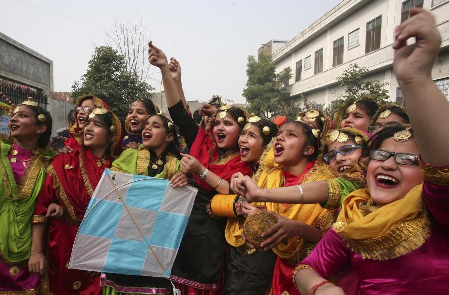 Lohri festival marks the culmination of winter in many parts of northern India. Here are some photos of Lohri festival celebration across India. Lohri,Lohri festival celebration,Lohri festival celebration in India,Lohri celebration in India,Lohri celebration,Lohri 2016,Lohri rituals,rituals lohri festival,Lohri Celebrations